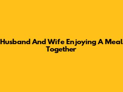 Husband And Wife Enjoying A Meal Together